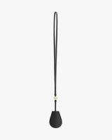 Teardrop-shaped pouch with long strap and small clasp design.