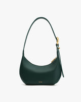 Shoulder bag with a curved shape and a metal clasp on the strap.
