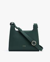 Handbag with adjustable strap and metal ring detail