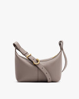 Shoulder bag with adjustable strap and gold buckle