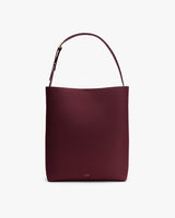 Tote bag with a single shoulder strap displayed upright.