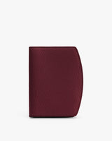 Textured wallet standing upright against a plain background.