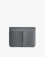 Rectangular clutch with front pouch pocket.