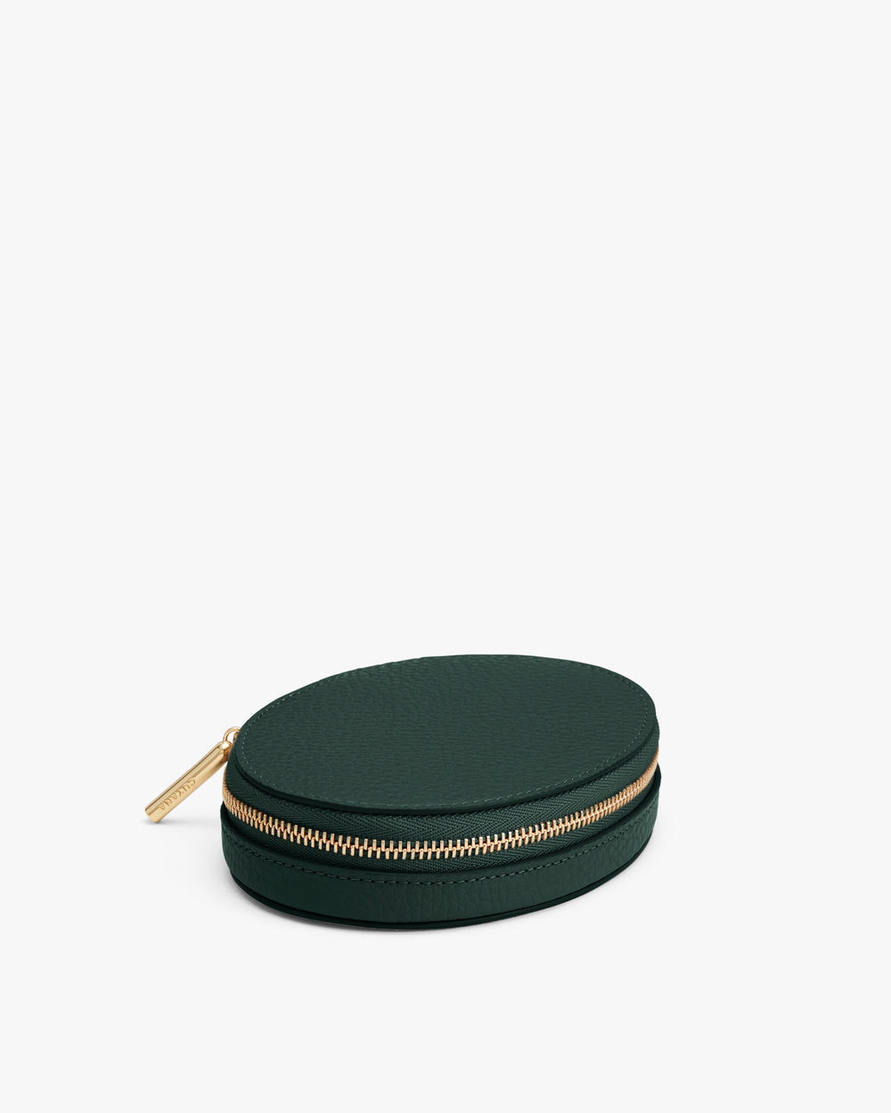 Round zippered leather pouch with gold zipper on white background
