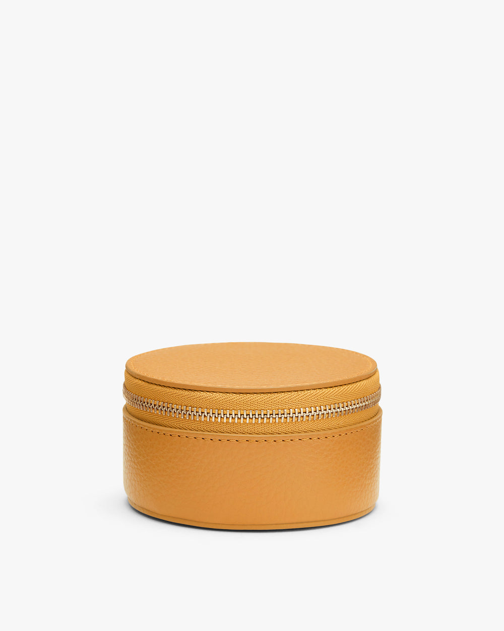 Round leather zippered case on a plain background.