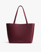 Tote bag with two handles on a plain background.