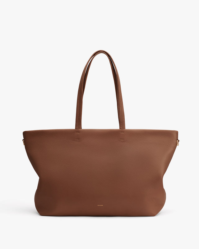 Large tote bag with two handles on a plain background.