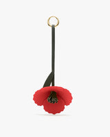 Flower-shaped keychain with ring and strap.