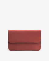 Rectangular textured clutch with flap closure.