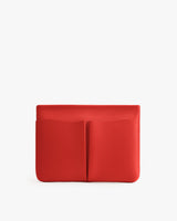 Rectangular clutch with two front pockets.