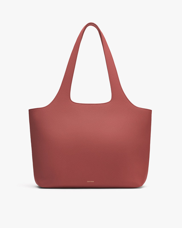 Tote bag with two handles on a plain background.