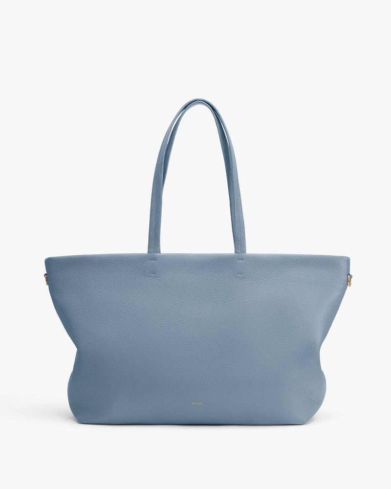 Large tote bag with two long handles displayed upright.
