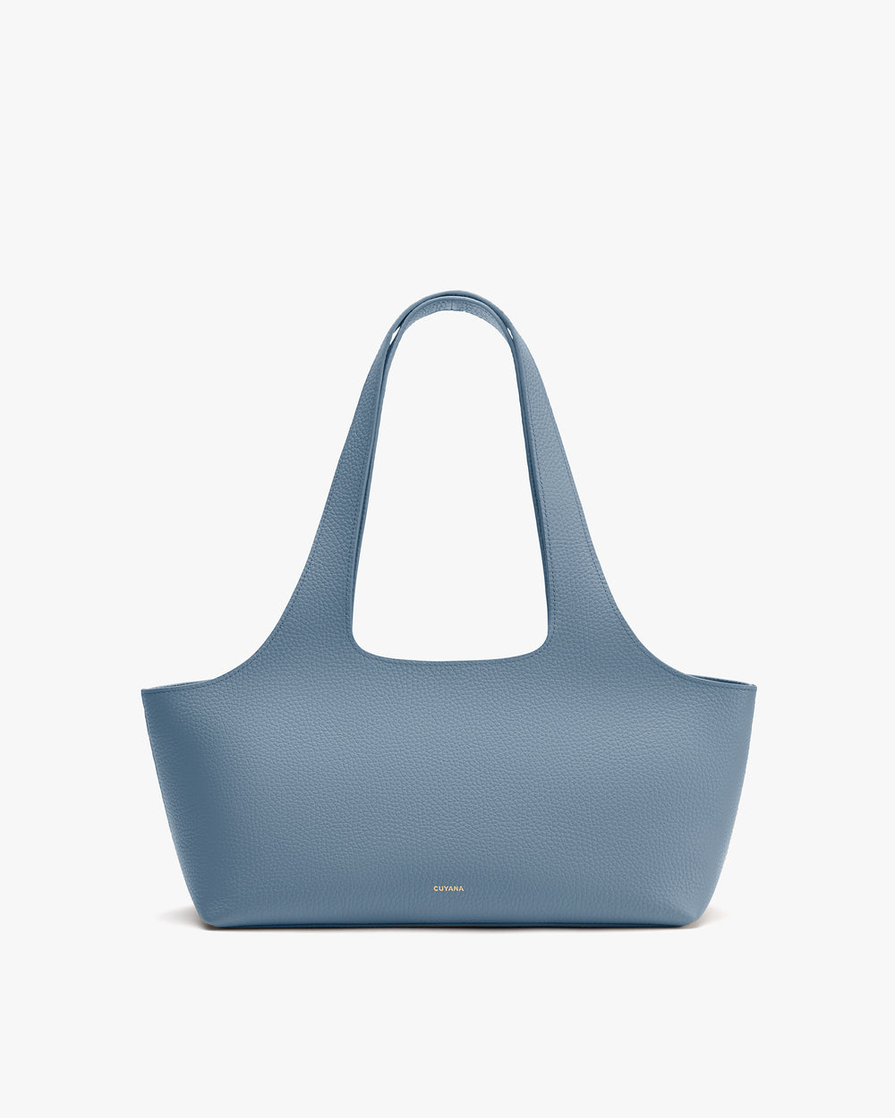 Handbag with long shoulder straps placed on a plain background.