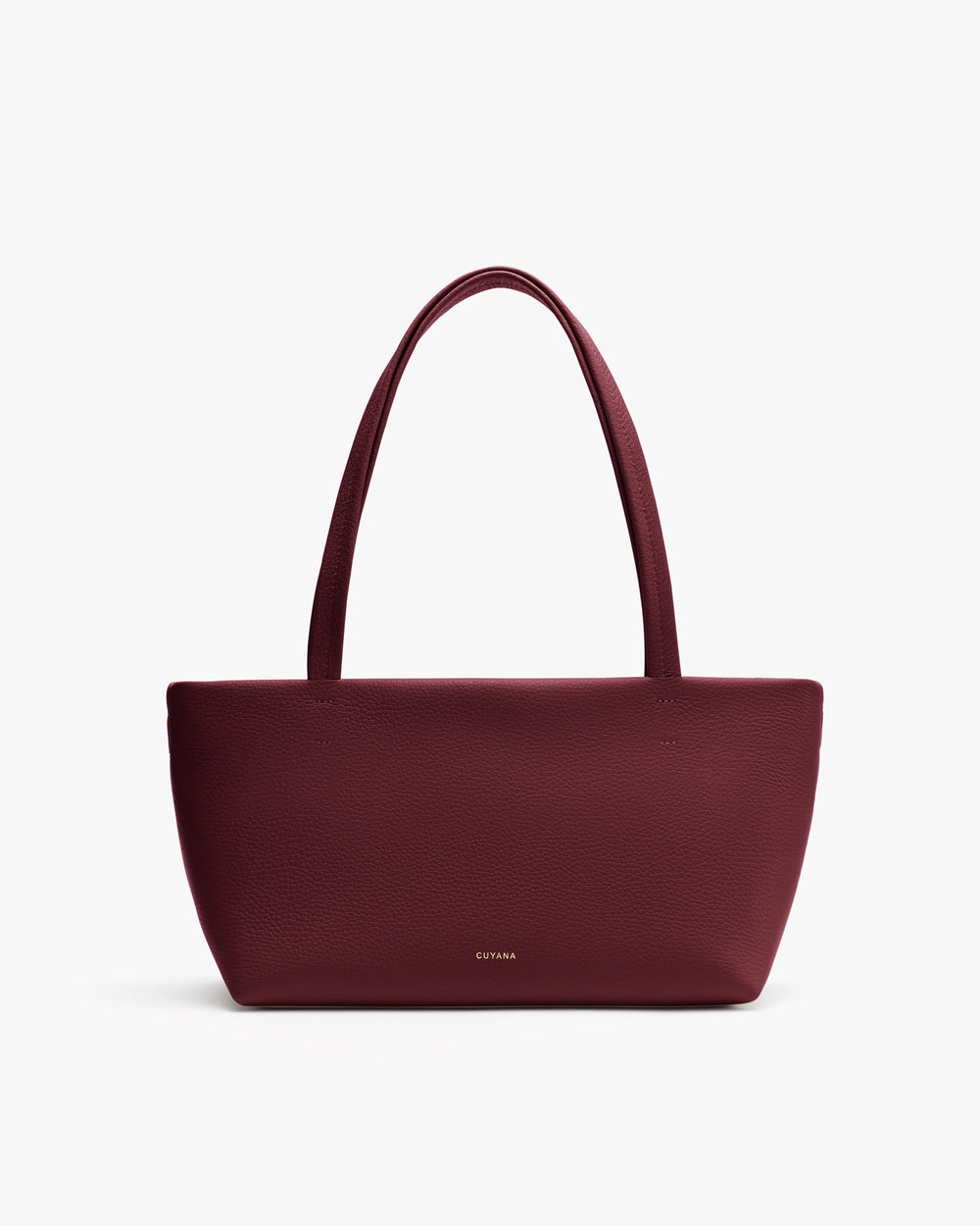 Tote bag with long handles against plain background.