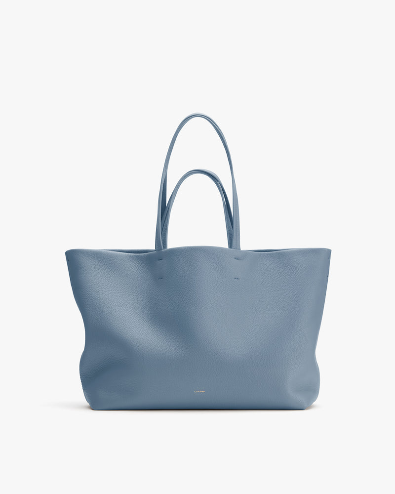 Large tote bag with two handles displayed on a plain background.