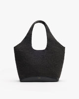 Woven tote bag with wide handles and simple design.