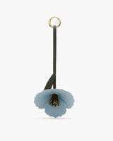 Flower-shaped keychain with a loop.