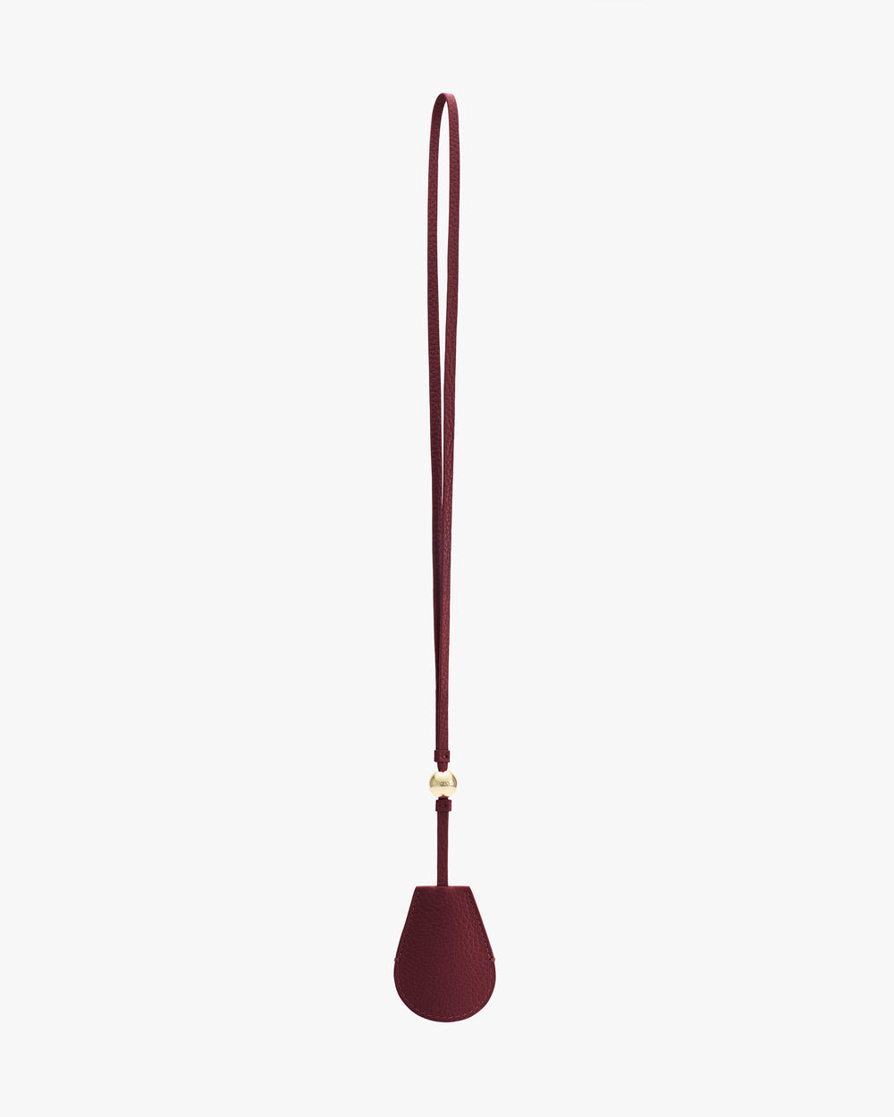 Teardrop-shaped bag charm with long strap.