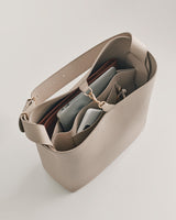 Open handbag with several items inside.
