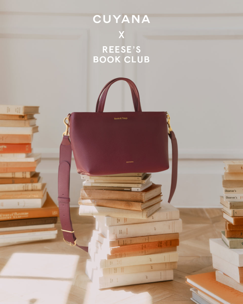 Handbag on stacks of books in a bright room with text above.