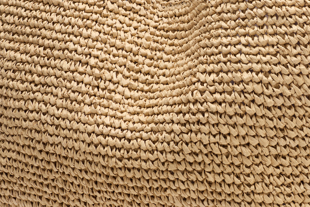 Close-up of woven straw texture pattern.
