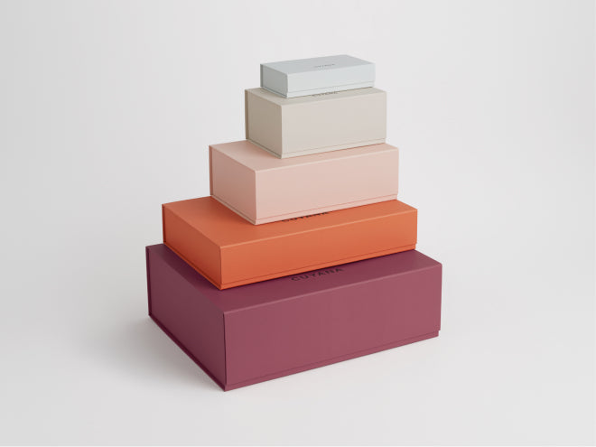Four stacked rectangular boxes in varying sizes.