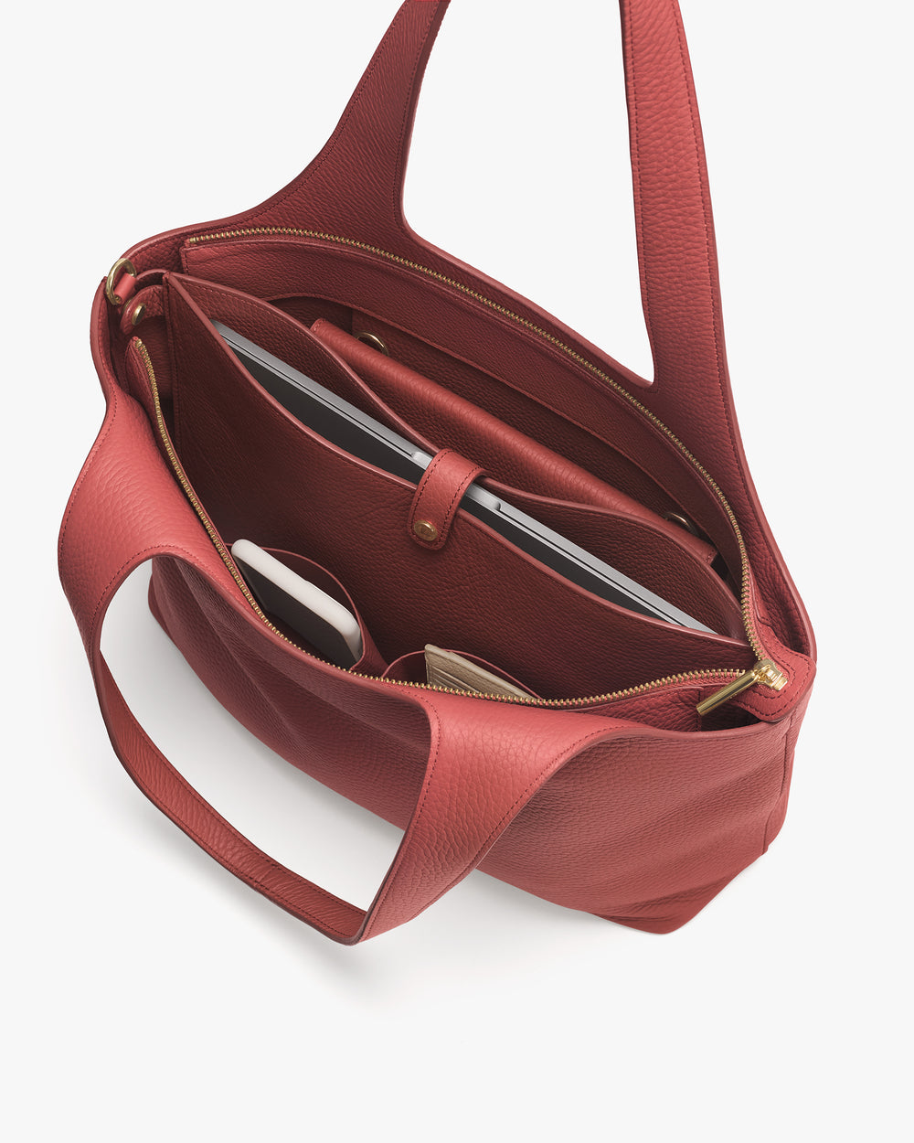 Open tote bag with organized compartments and items inside.
