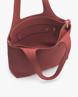 Open handbag with a zipper and inner pocket visible.