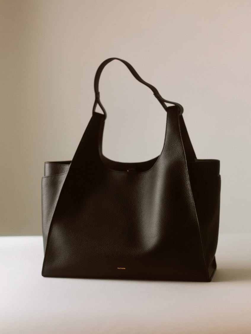 A large tote bag with a simple design and handle.