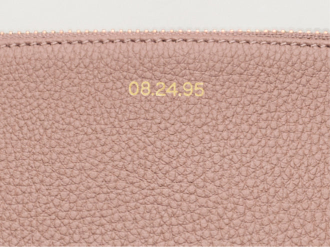 Close-up of leather with date 08.24.95 stamped on it.