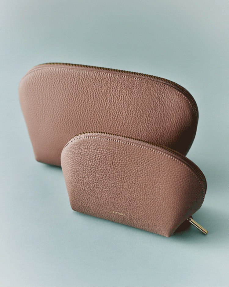 Two textured pouches, one larger than the other, on a simple background.