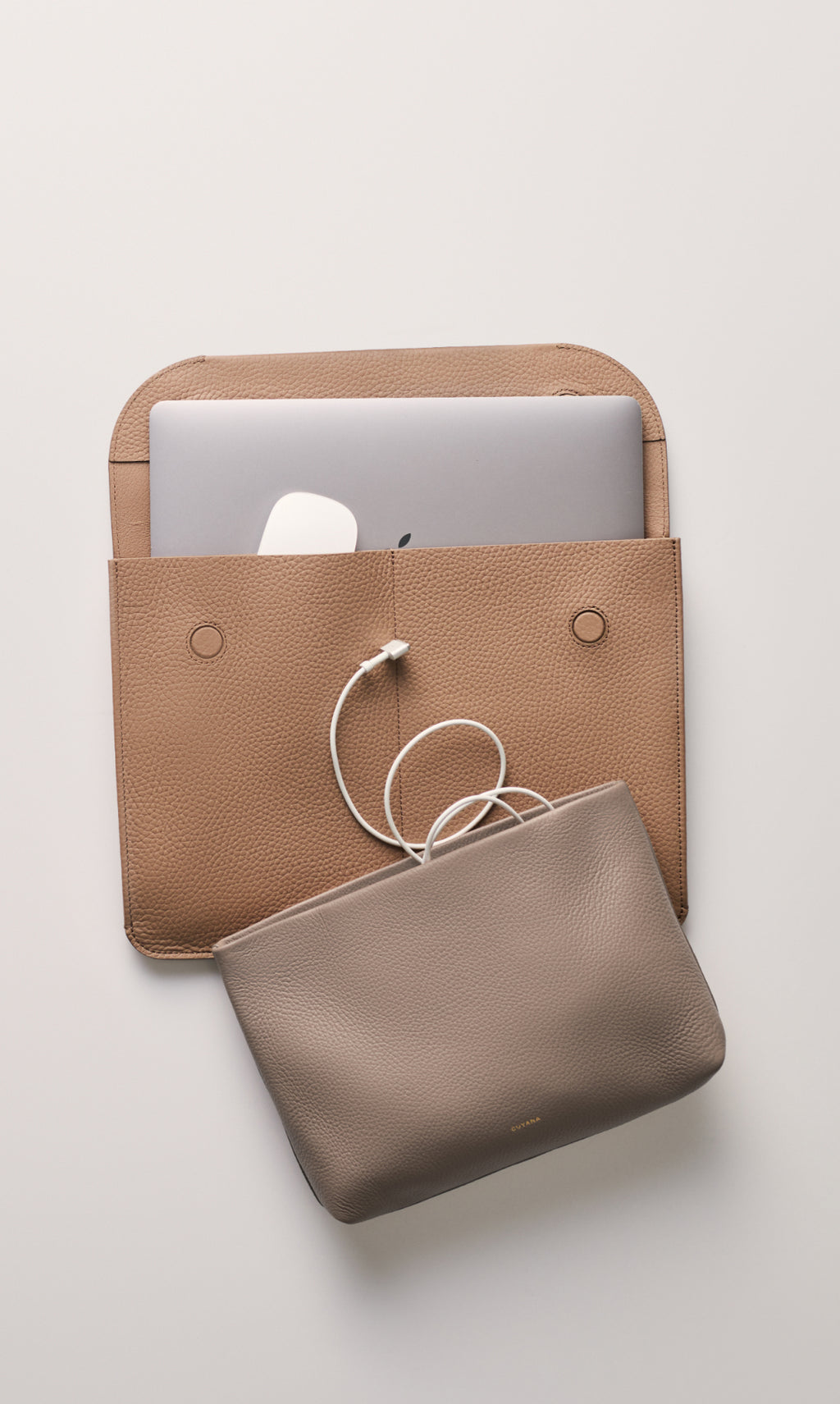 Laptop sleeve and pouch with charging cable.