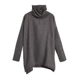 Turtleneck sweater with long sleeves and asymmetric hem.