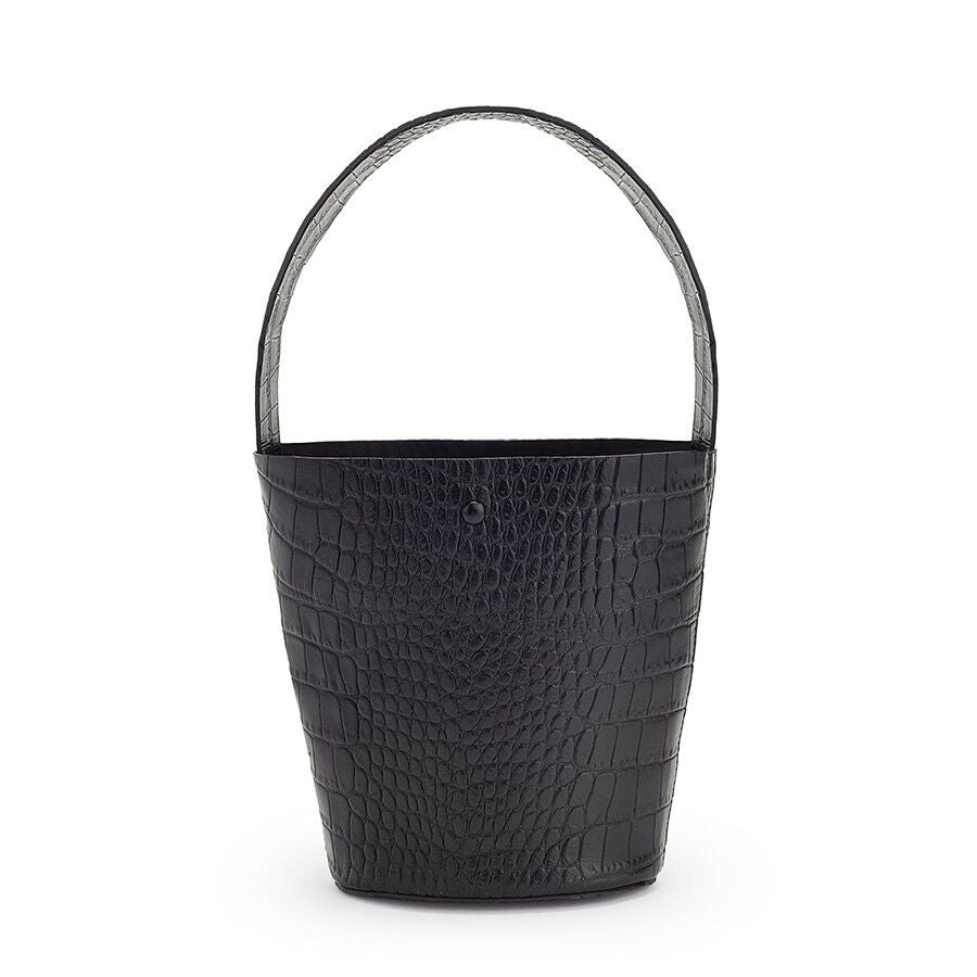 Handbag with a textured pattern and a single handle, on a plain background.