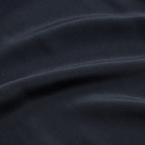Close-up view of a smooth fabric with wrinkles.