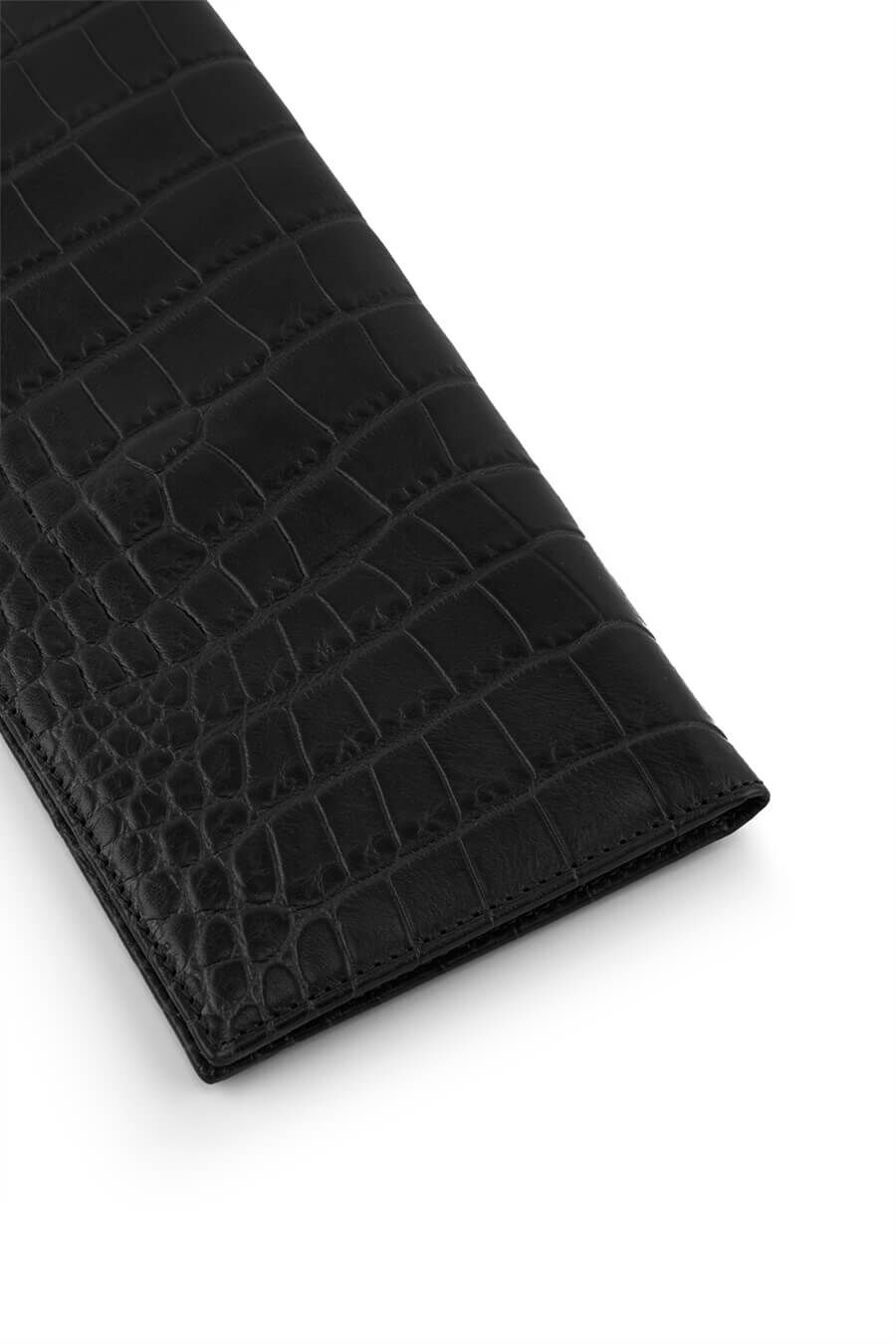 Close-up of a textured wallet on a white background.