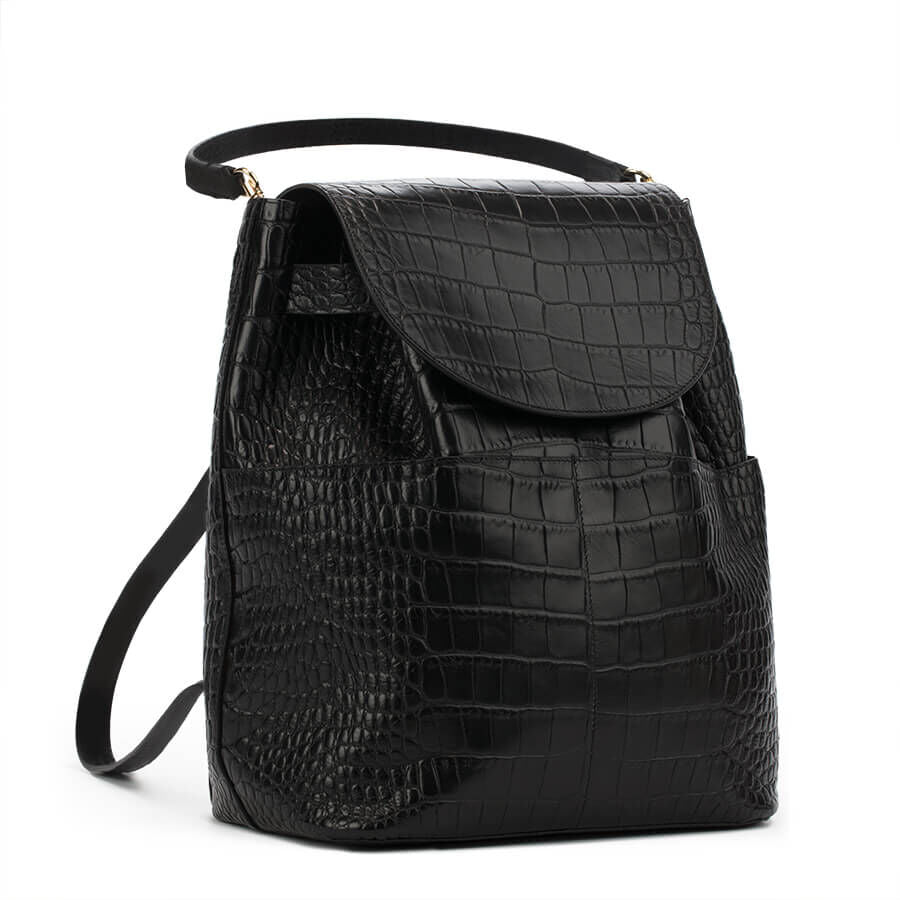 Black handbag with a textured design and shoulder strap.