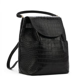 Black handbag with a textured design and shoulder strap.