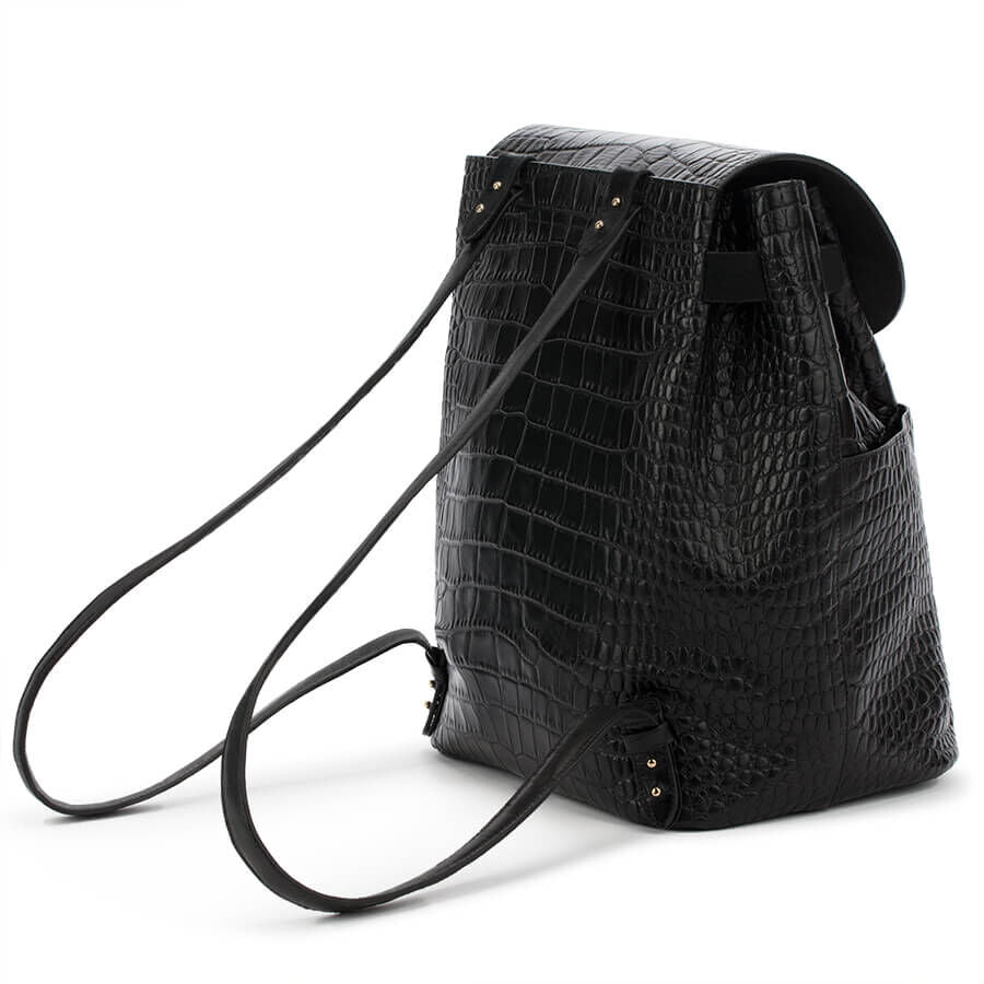 Black textured backpack with a shoulder strap and buckle detail.