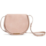 Round shoulder bag with adjustable strap and front flap closure.