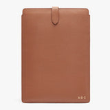 Leatherette tablet case with monogrammed initials and flap closure