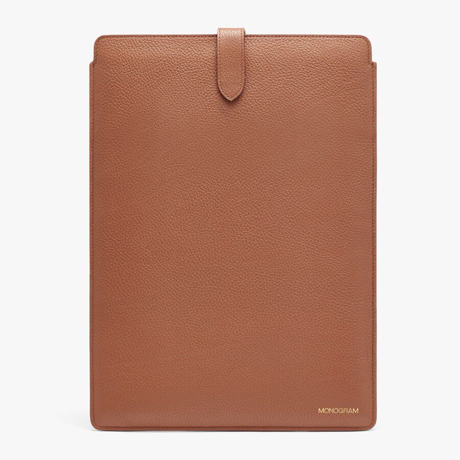 Leather tablet case with a tab closure and brand logo at bottom.