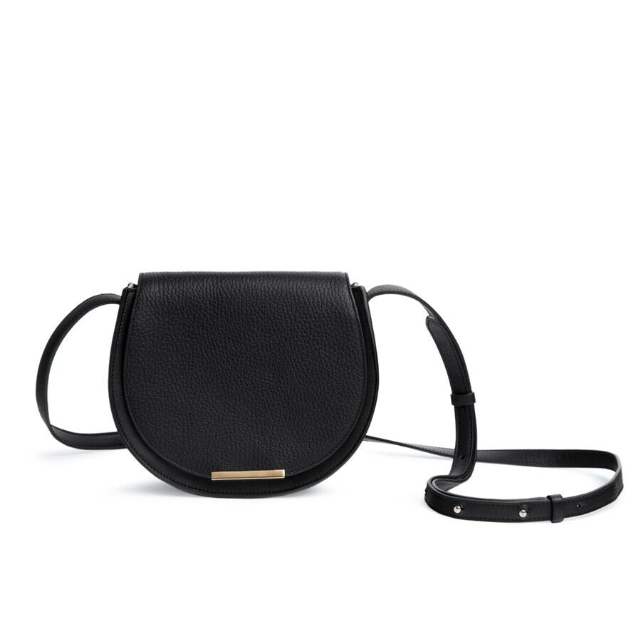 Round shoulder bag with adjustable strap and front clasp.