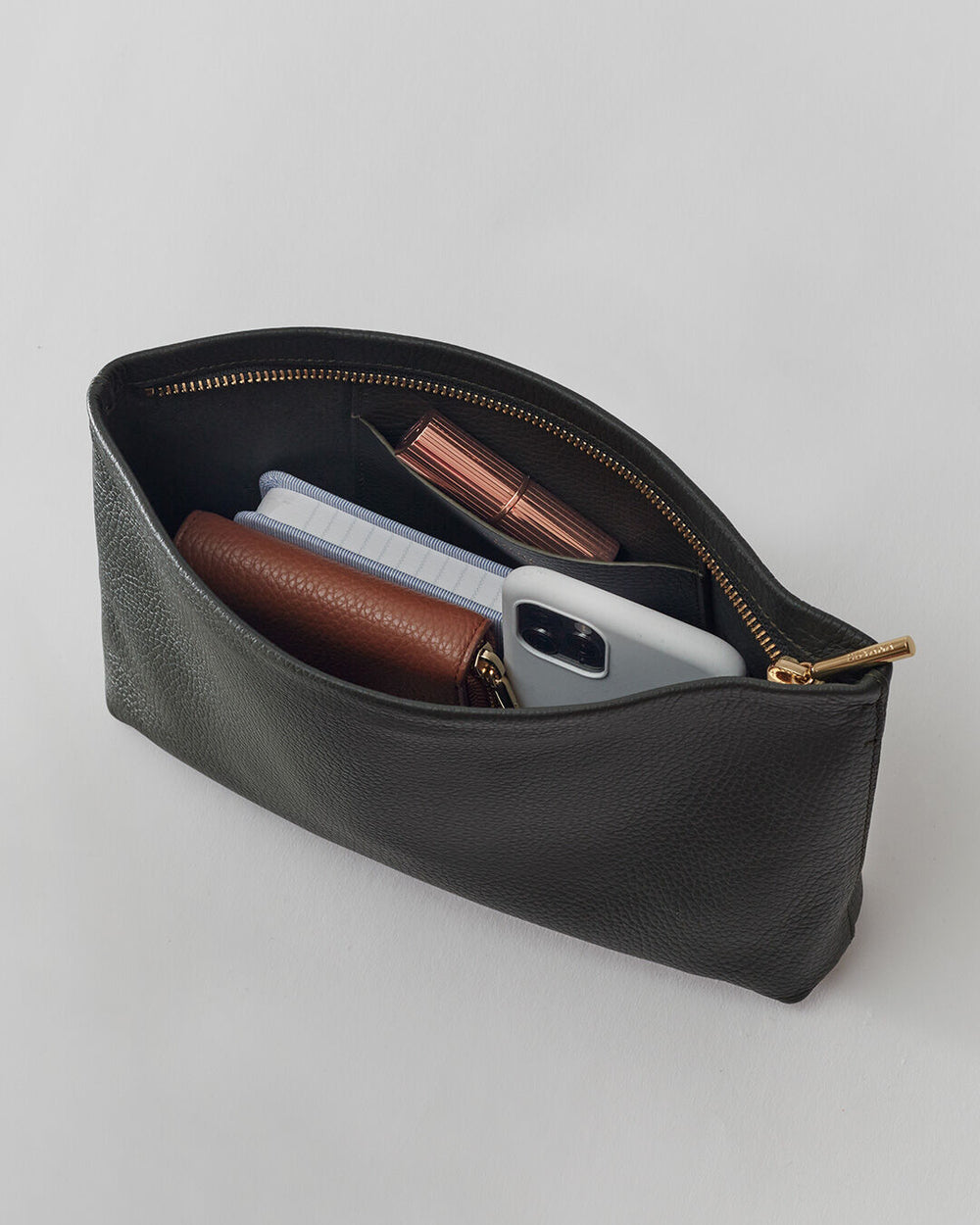 Pouch containing a wallet, phone, and cosmetics.