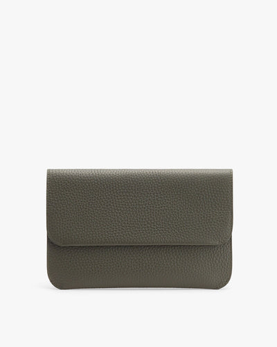 Small folded purse with a textured surface, isolated on a plain background