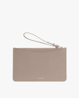 Wristlet with brand logo and zipper closure.