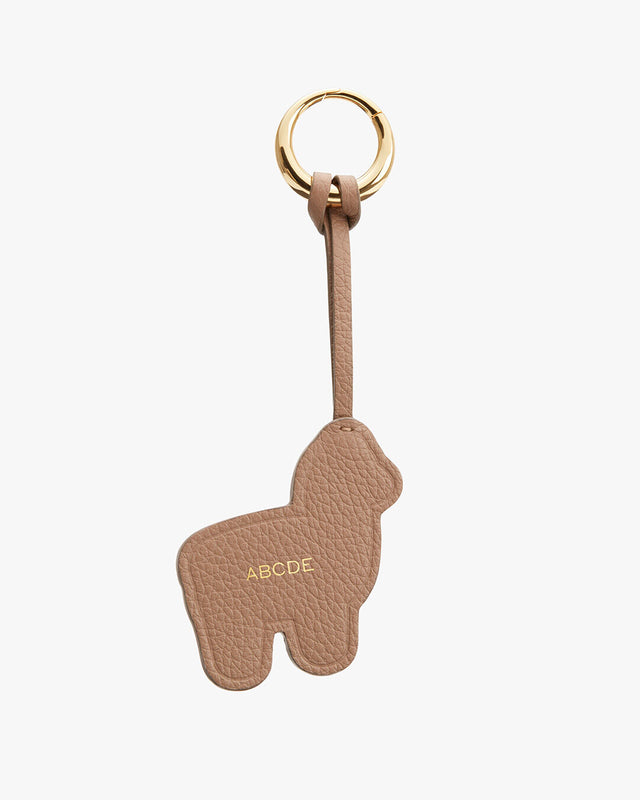 Keychain shaped like an alpaca with an attached ring and personalized initials.