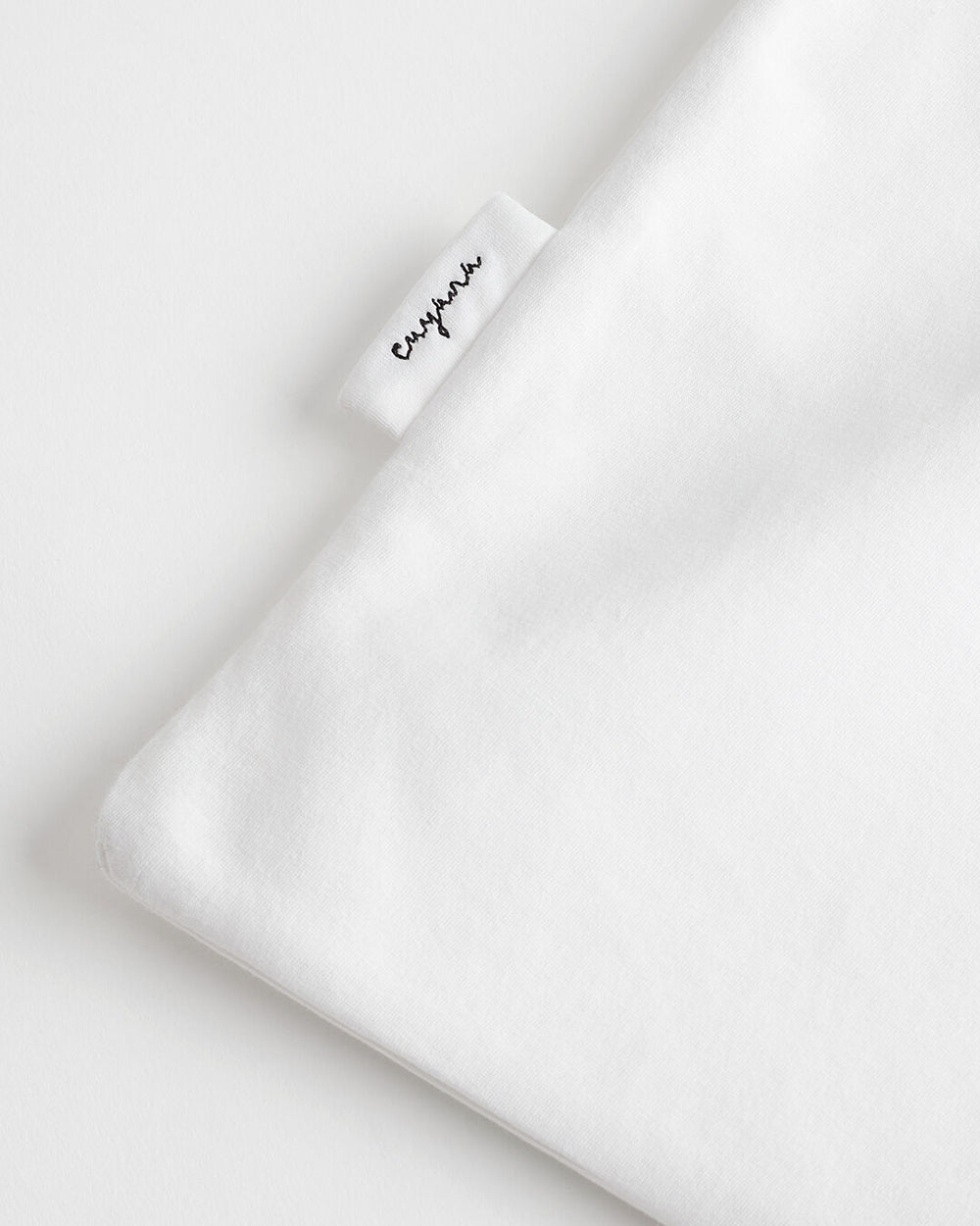 Folded fabric with a visible label marked 'Cuyana'
