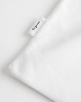 Folded fabric with a visible label marked 'Cuyana'