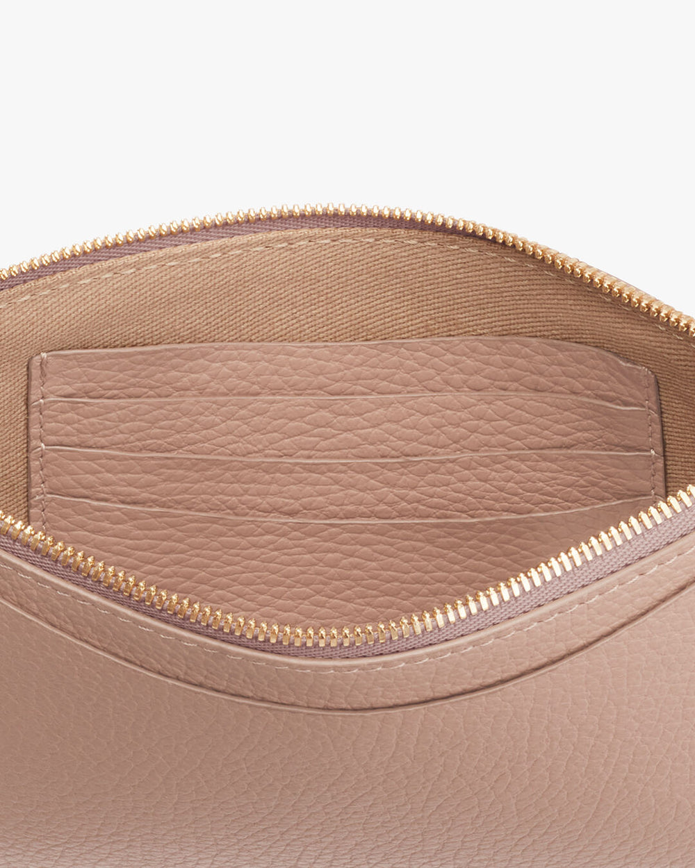 Close-up view of an open bag with a zipper and an inner pocket.